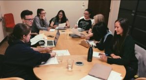 A group of former interns gather during one of the program's seminars. Photo by Quincie Hydock.